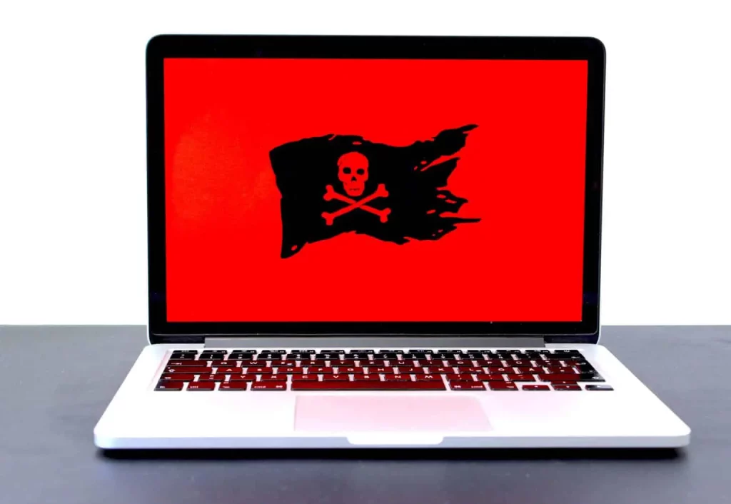 A laptop with a pirate flag on it, used for WordPress Website Maintenance in Penetanguishene.