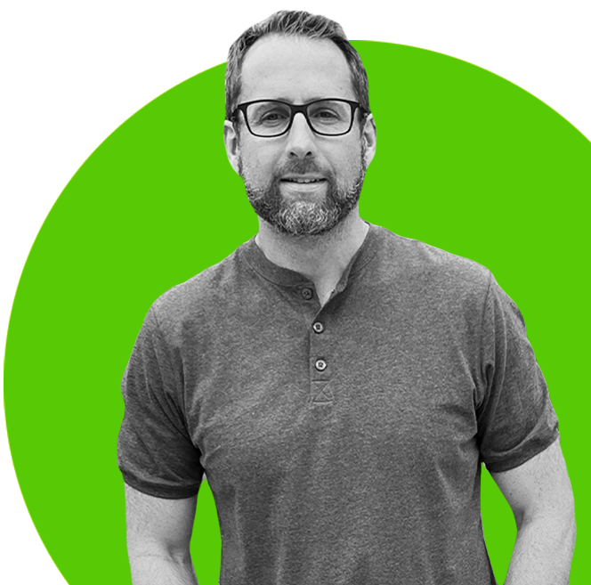 About Us - A man in glasses standing in front of a green circle at Certtech Web Solutions.