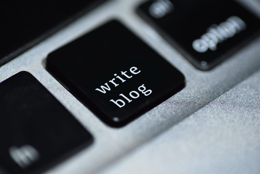 Keyboard button labeled as "Write Blog"