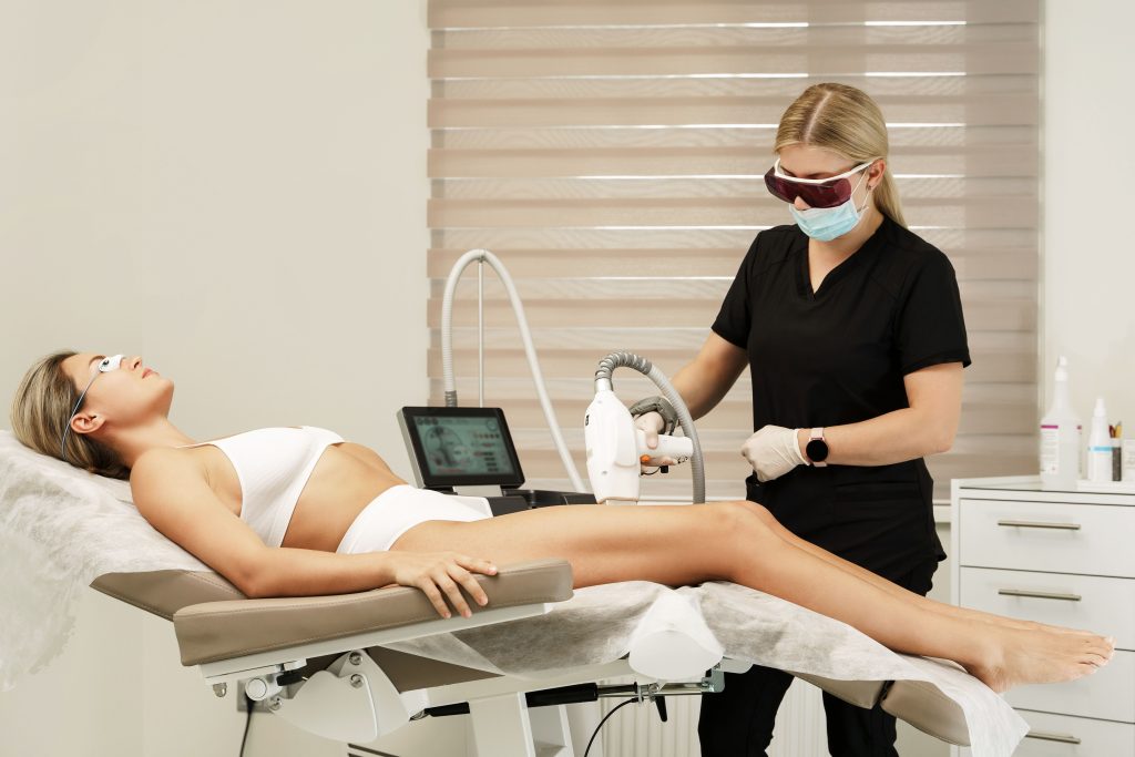 A woman is undergoing a laser treatment at an Aesthetic Clinic.