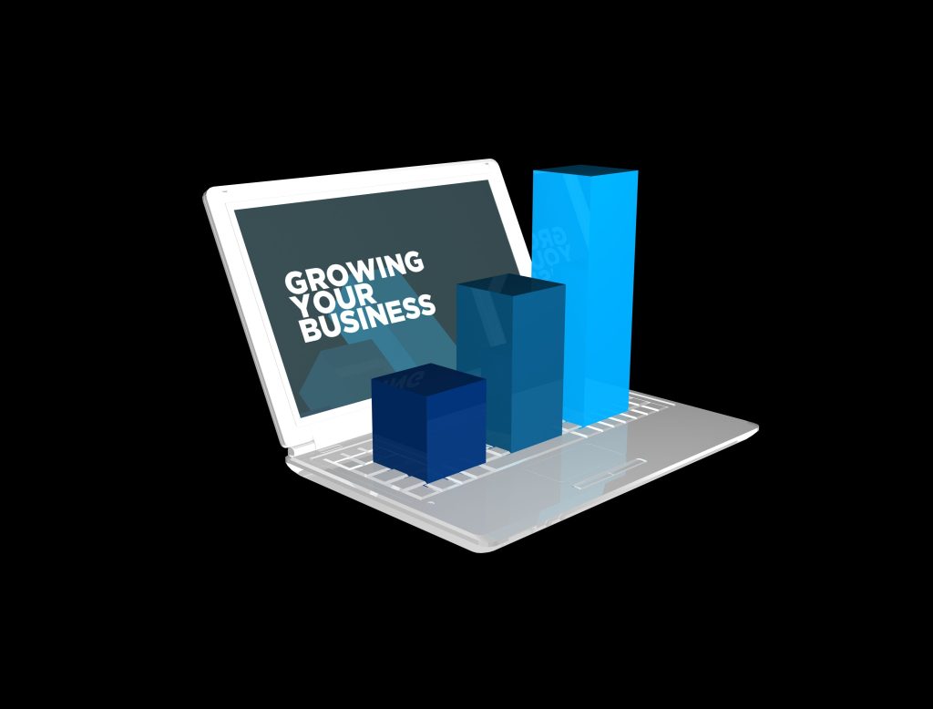 A laptop with the words "Grow Your Business" on it.