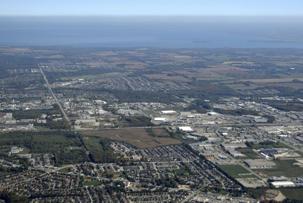 An aerial view of a city and a body of water, showcasing the stunning skyline and waterfront scenery.